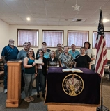 SLVFB employees presenting a We Care, We Share donation to BPOE Elks Lodge Alamosa