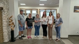 SLVFB employees presenting a We Care, We Share donation to Conour Animal Shelter