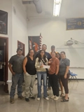 SLVFB employees presenting a We Care, We Share donation to Friends of the Alamosa FFA