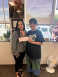 SLVFB employees presenting a We Care, We Share donation to Habitat for Humanity