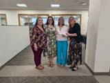 SLVFB employees presenting a We Care, We Share donation to Kid's Place of the San Luis Valley