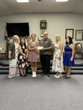 SLVFB employees presenting a We Care, We Share donation to Monte Vista #23 International Order of Rainbow for Girls