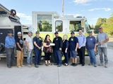 SLVFB employees presenting a We Care, We Share donation to Monte Vista Fire Department