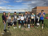 SLVFB employees presenting a We Care, We Share donation to SLV Elite Wrestling Club