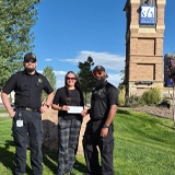 SLVFB employees presenting a We Care, We Share donation to SLV Health Foundation - EMS