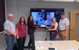 SLVFB employees presenting a We Care, We Share donation to SLV Housing Coalition