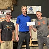 SLVFB employees presenting a We Care, We Share donation to SLV Youth Shooting Sports