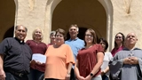 SLVFB employees presenting a We Care, We Share donation to Sacred Heart Church